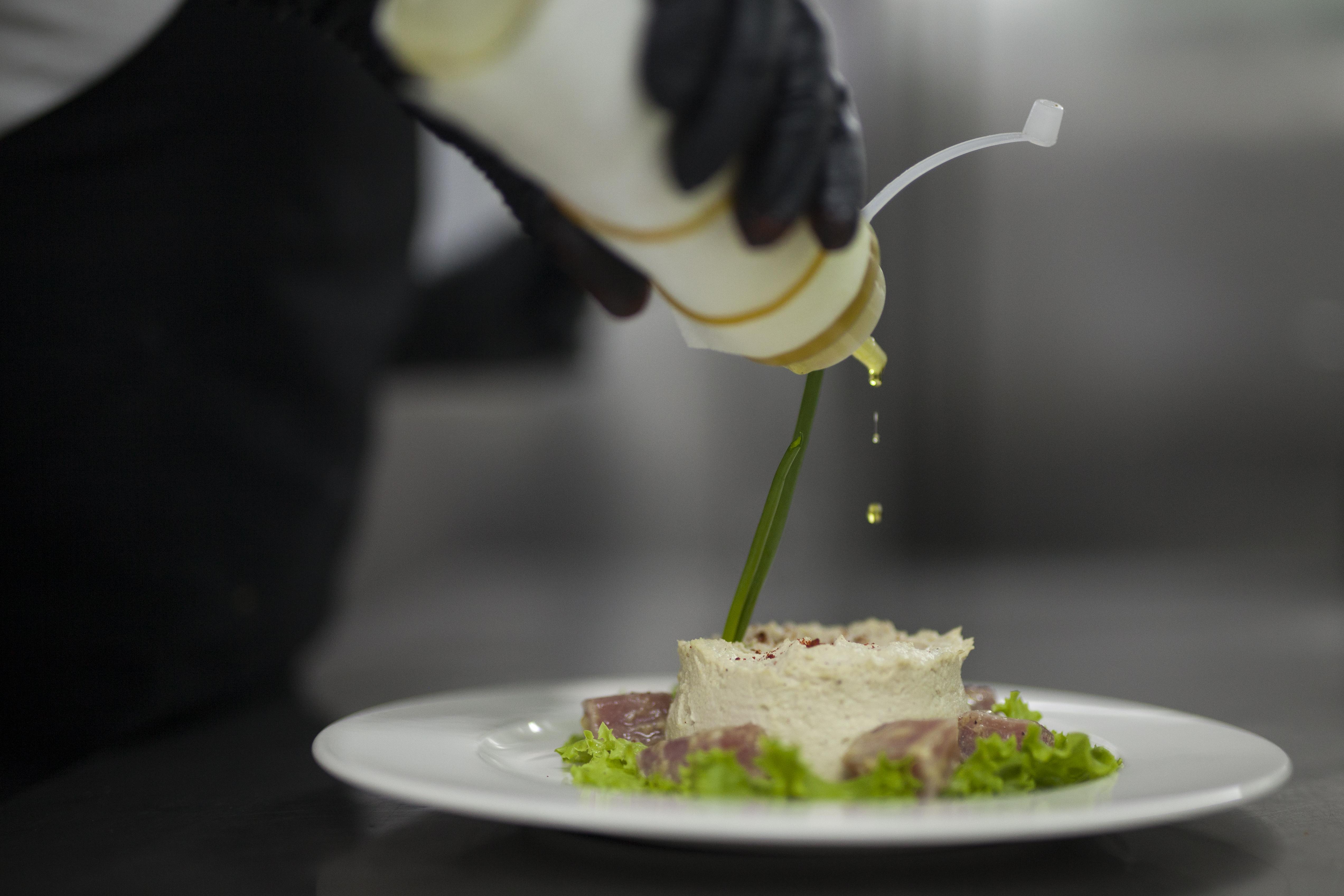 Grand Hotel Yerevan - Small Luxury Hotels Of The World Eksteriør bilde A chef finishing a dish